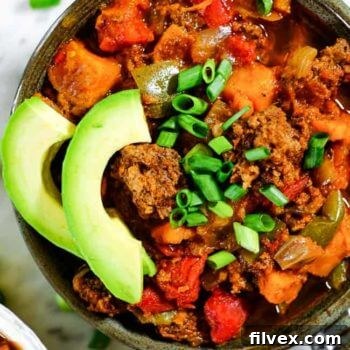 Paleo + Whole30 Sweet Potato Chili with avocado and green onions