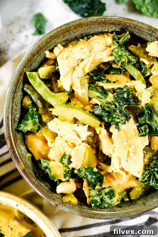 Close up shot of Thai coconut curry served in a bowl.