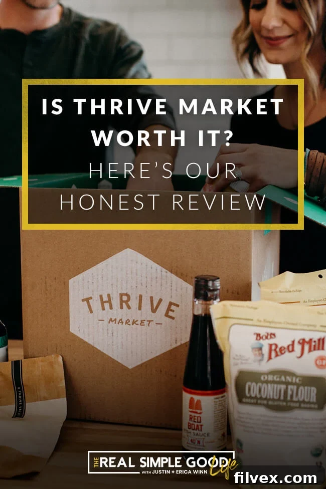 Justin and Erica Winn in the kitchen sticking hands in a Thrive Market box, illustrating the convenience of home delivery.