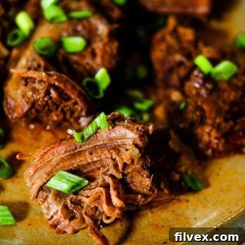 Instant Pot Short Ribs garnished with green onion.