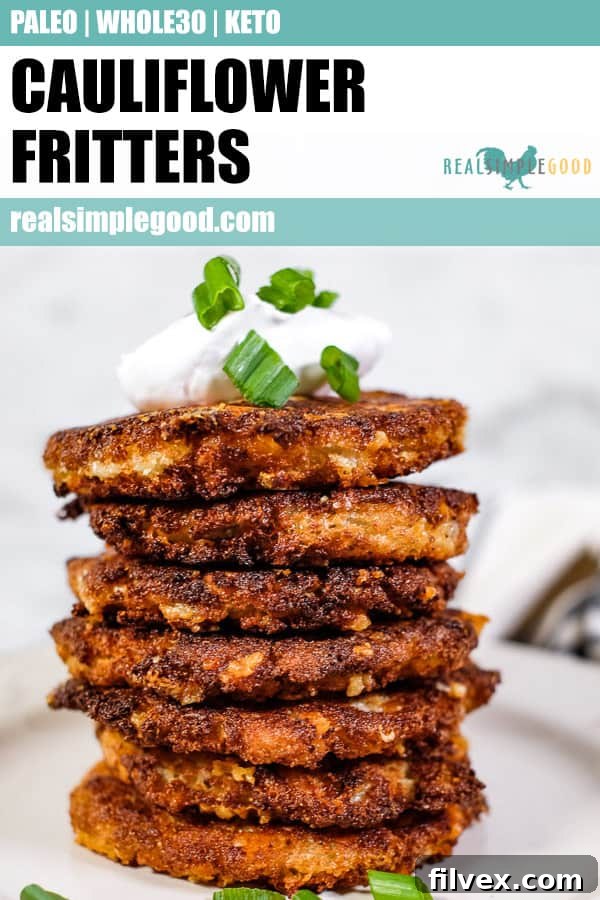 Stack of cauliflower fritters, topped with coconut yogurt and chopped green onion.