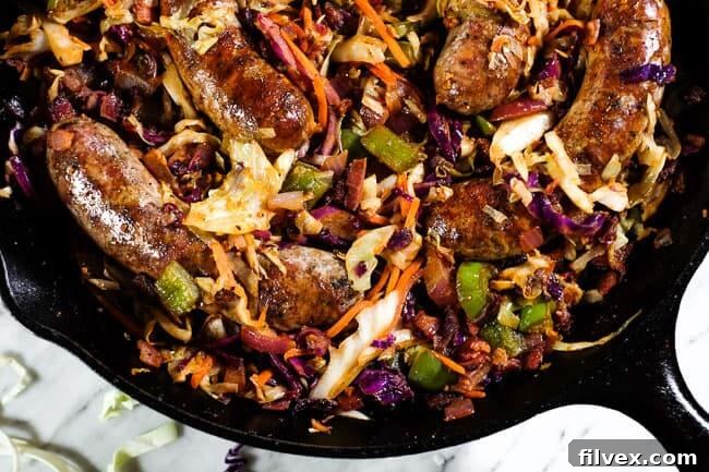 One pan sausage and cabbage skillet in cast iron skillet, ready to serve.