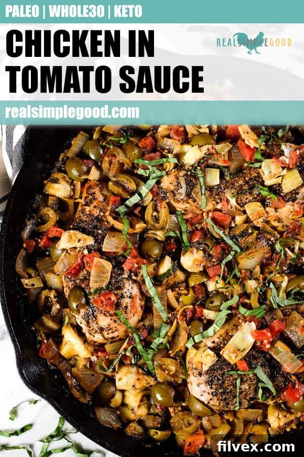 A large skillet filled with creamy chicken in tomato sauce, garnished generously with fresh basil leaves, ready to be served or added to a meal prep rotation.