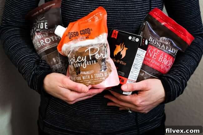 Holding several different kinds of bone broth and a post about where to buy bone broth. 