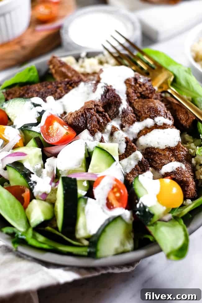 Full shot of a beautifully assembled Beef Shawarma Bowl, highlighting all ingredients for a healthy, satisfying meal.