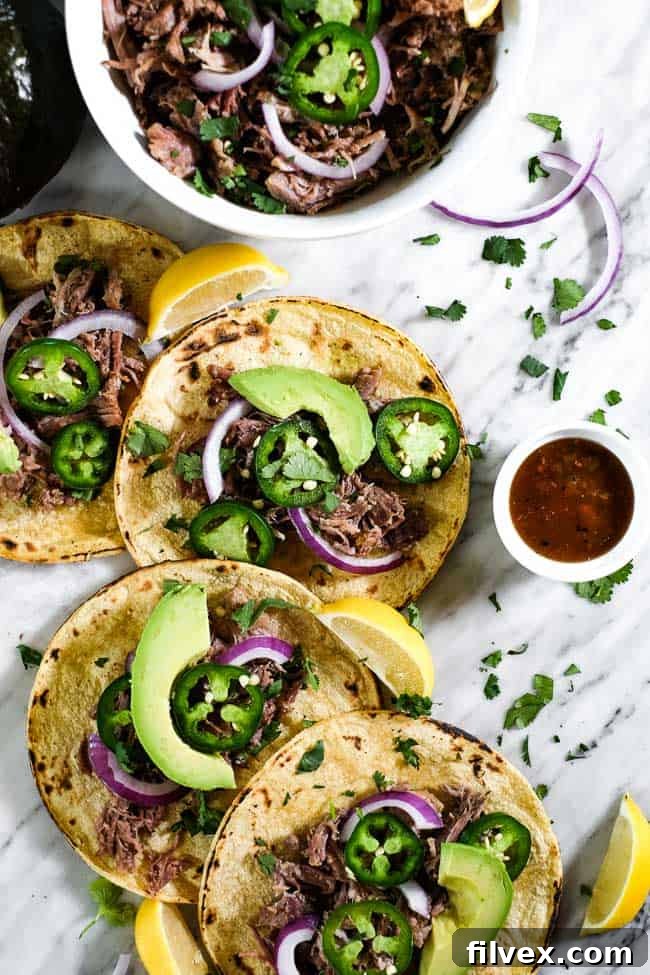 A plate of Mojo Pork served with plantains.