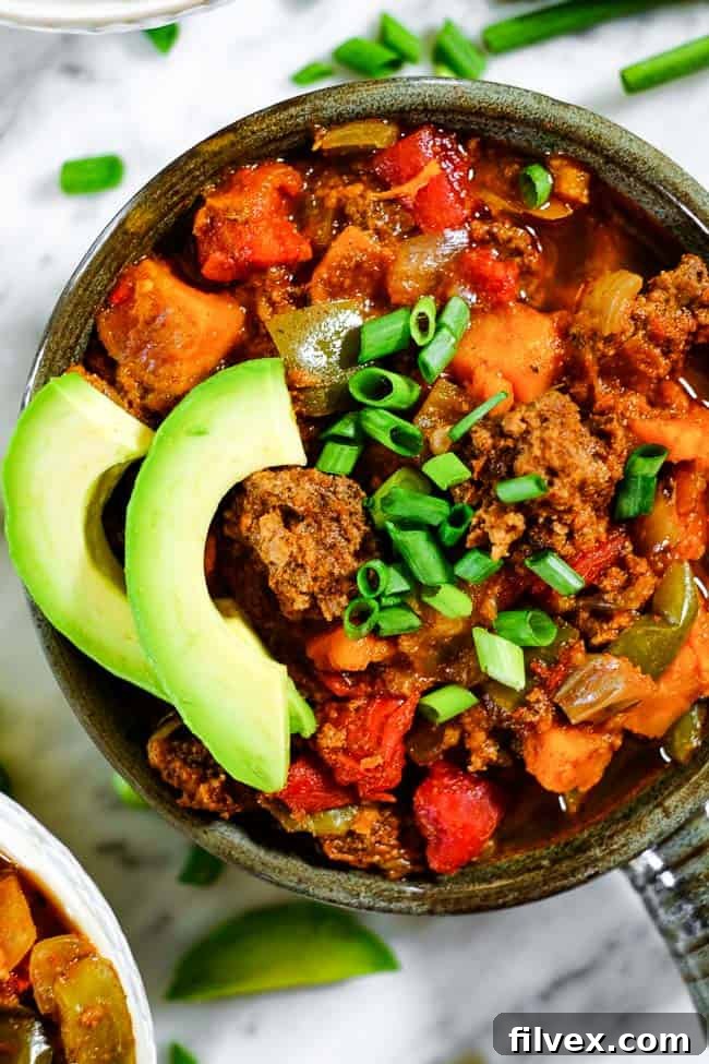 A bowl of hearty Sweet Potato Chili topped with fresh cilantro.