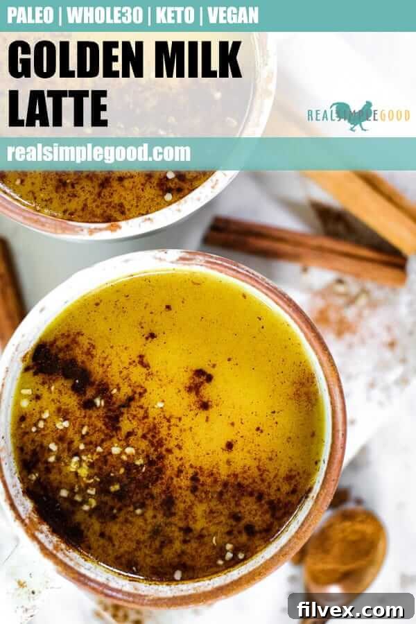 Close up shot of golden milk latte in a mug, sprinkled with cinnamon and hemp seeds, highlighting the drink's rich texture.