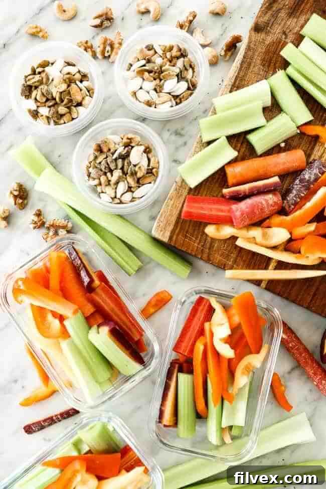 Chopped veggies in container and nuts