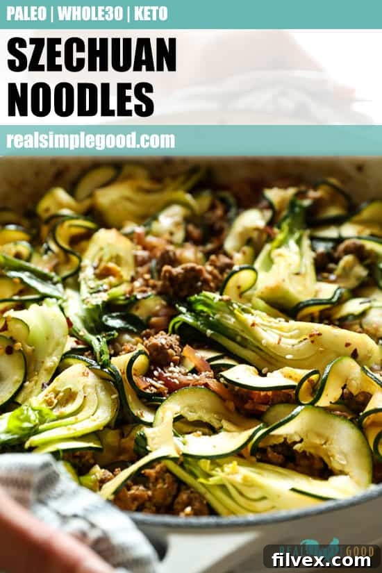 Close up shot of holding skillet with Szechuan noodles. Text overlay at top for pinterest. 