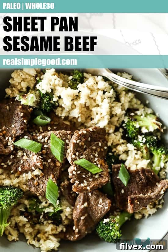 Close up image of sheet pan sesame beef in a bowl with cauliflower rice and broccoli. Perfect for pinning on Pinterest. 