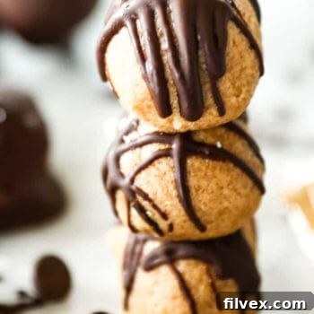 A stack of three delicious peanut butter balls, coated in chocolate, serving as the main recipe image.