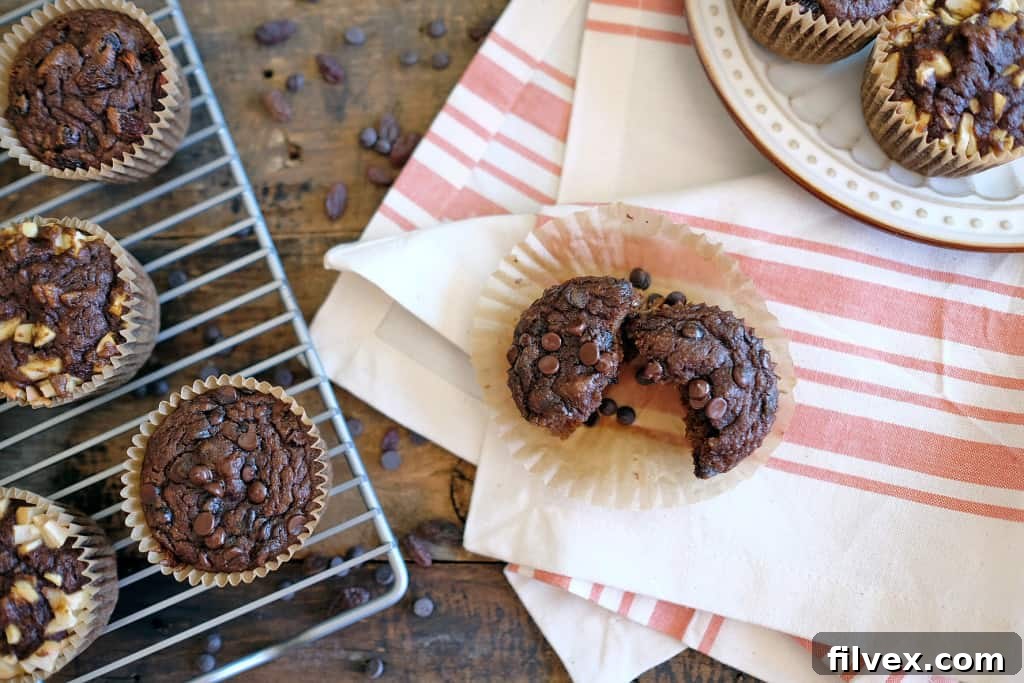Two pumpkin muffins with various toppings, showcasing their delicious texture