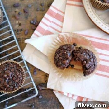 A batch of freshly baked pumpkin muffins cooling on a rack