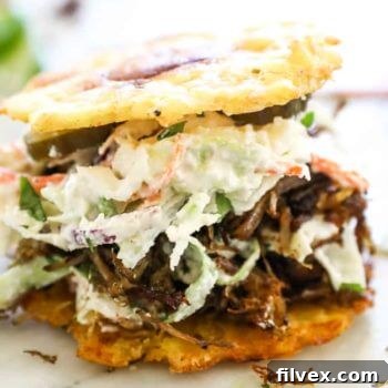 Jibarito with plantain buns, pulled pork, and slaw.