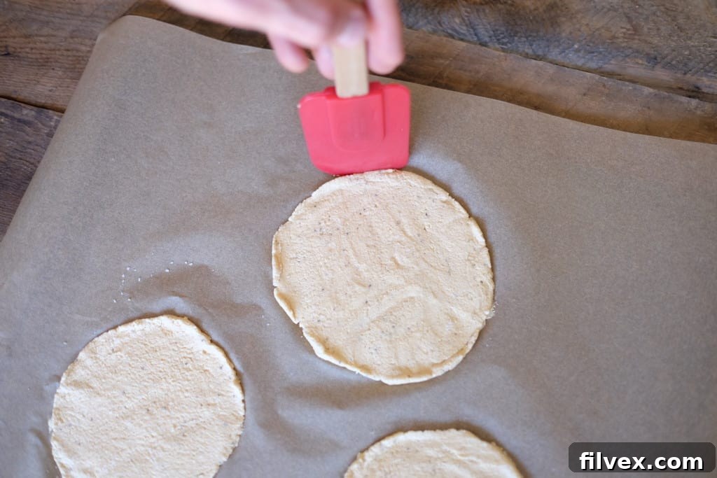 Plantain tostadas dough spread on parchment paper