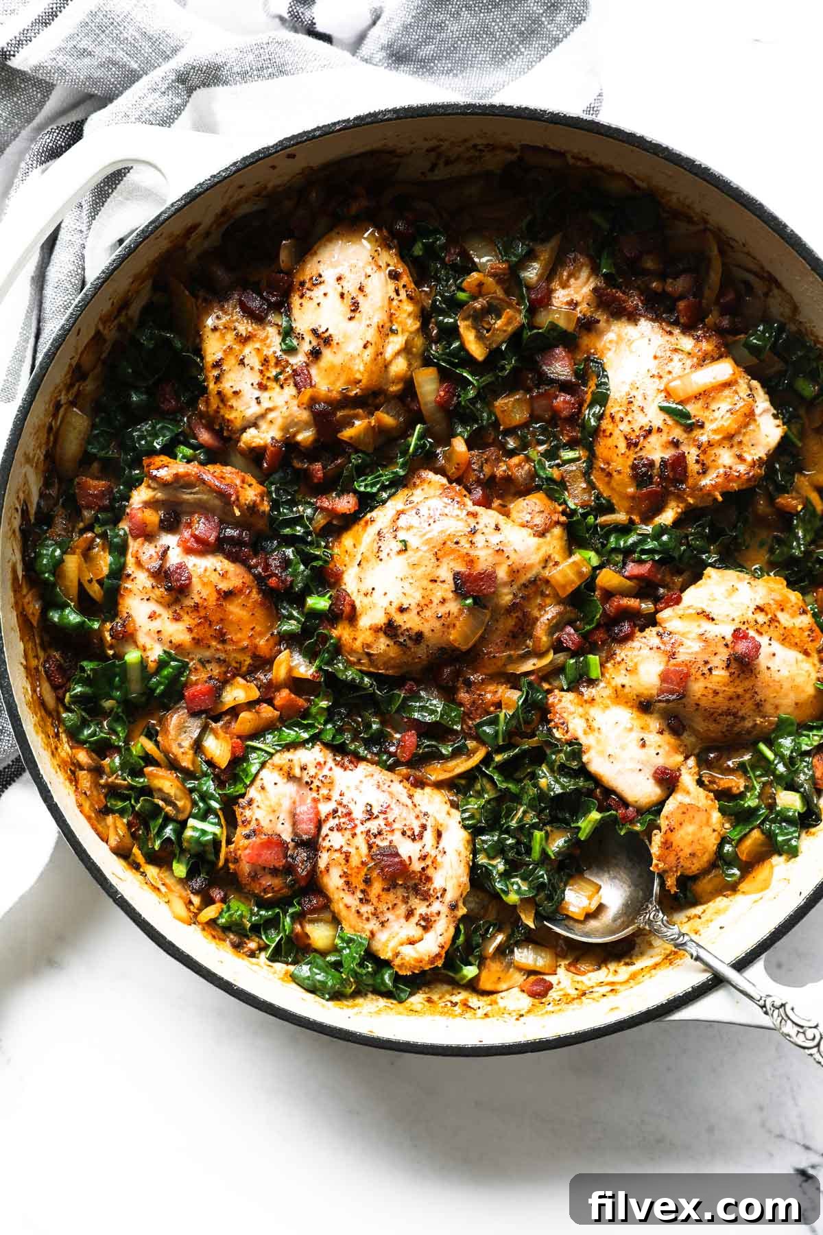 A close-up of the creamy mustard chicken in a skillet, showing the sauce and texture.