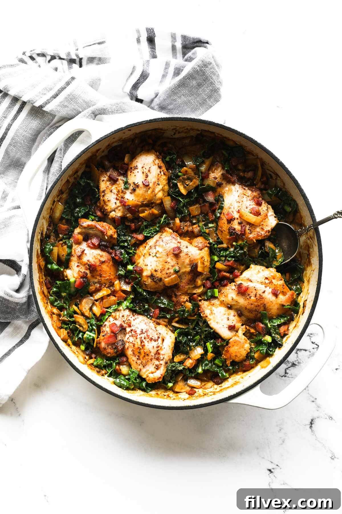 Finished creamy mustard chicken served in a skillet, ready to eat.