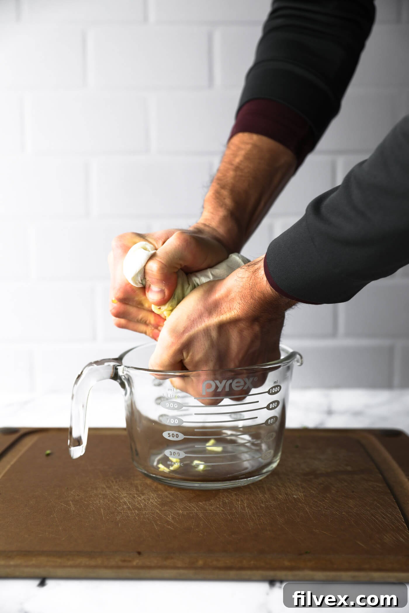 Squeeze as much juice as you can out of the zucchini noodles.