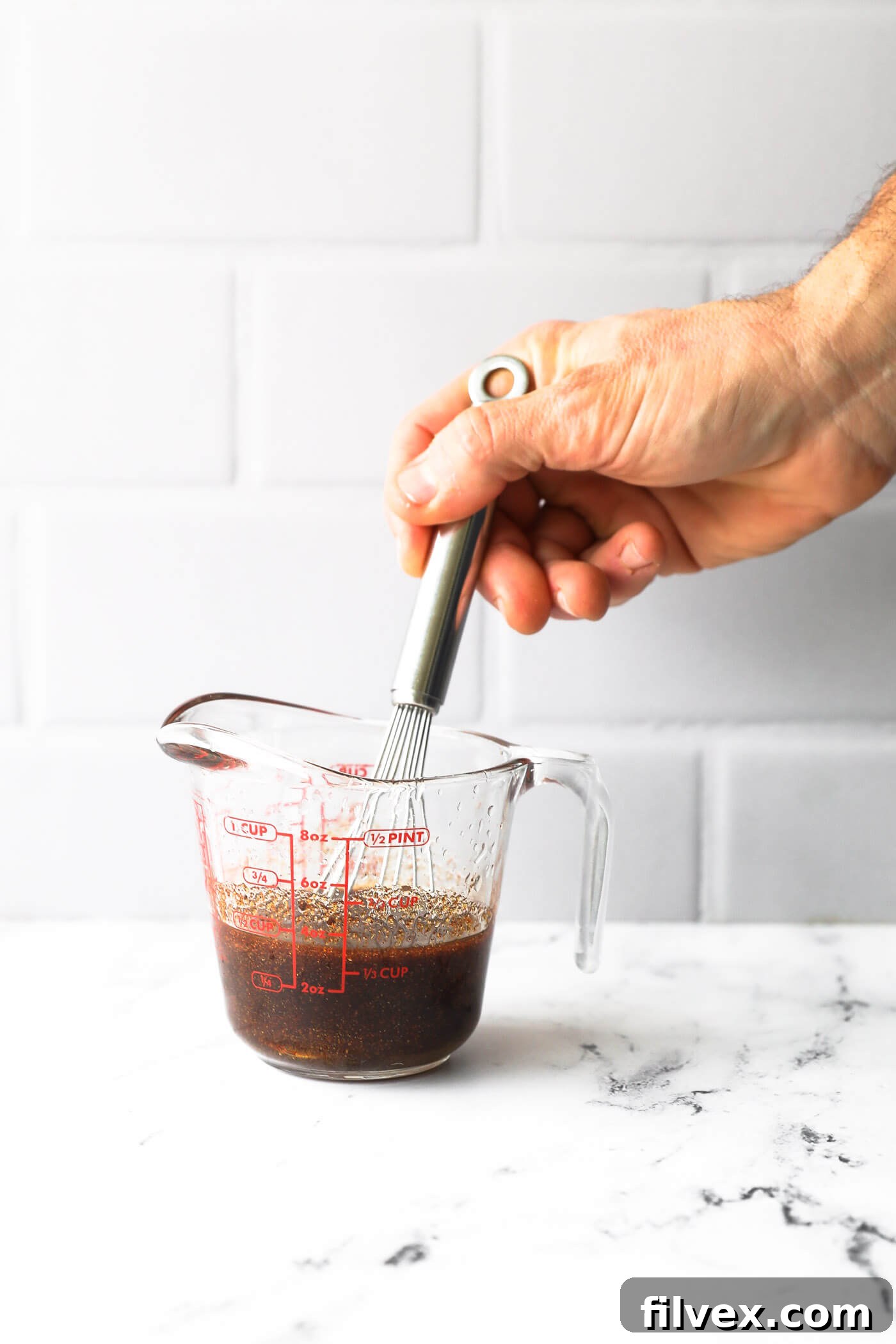 While the casserole is baking, prepare the sauce and slice the green onions.