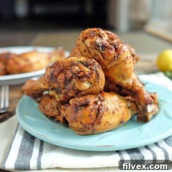 A perfectly cooked Lemon Thyme Chicken dish, golden brown and garnished.