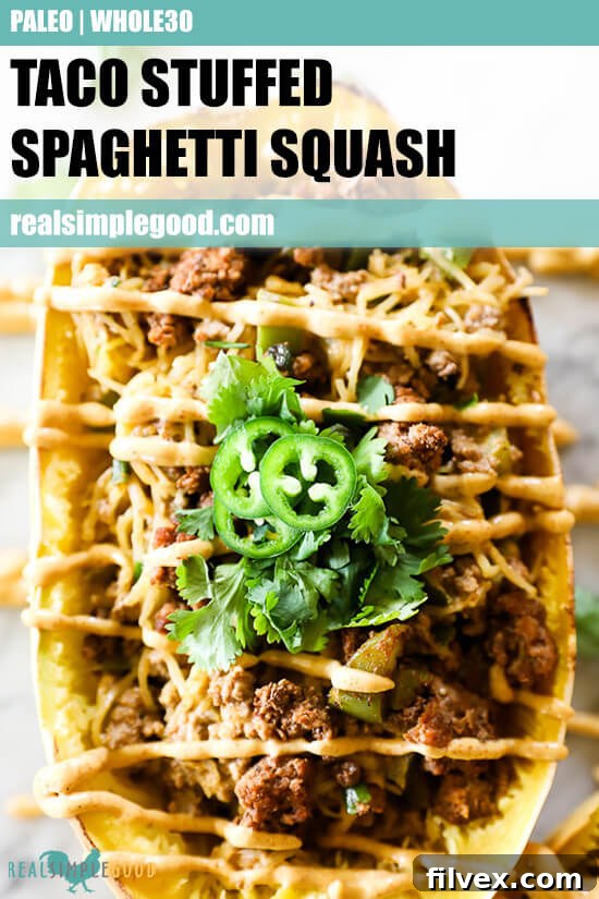 Taco stuffed spaghetti squash with sauce drizzled on top and descriptive text at the top.