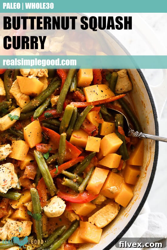 Close up image of butternut squash curry in a skillet with serving spoon. Text overlay at top. 