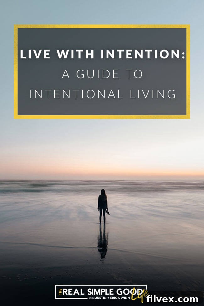 A serene image of a woman standing on a beach, facing the ocean, with the text overlay: 'Live with Intention: A Guide to Intentional Living.' This represents freedom, purpose, and clarity.