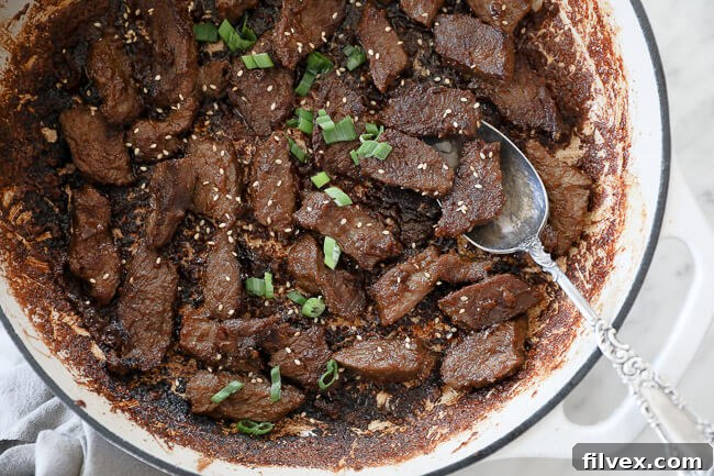 Sizzling Korean beef bulgogi in a pan, ready to be served