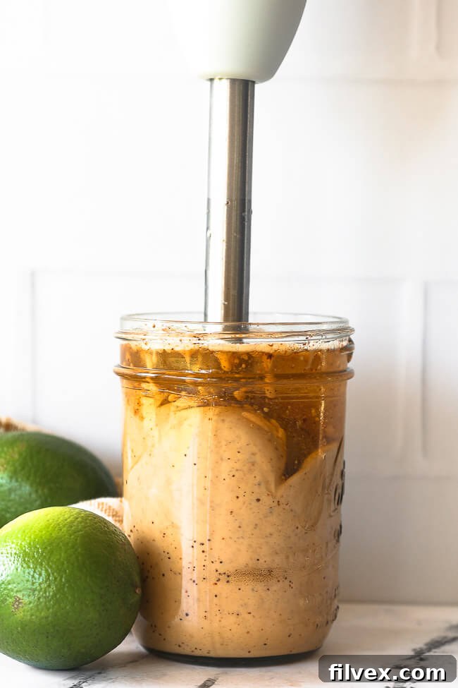 Fresh lime, garlic, and chipotle powder—key ingredients for a flavorful homemade aioli—artfully arranged for cooking.