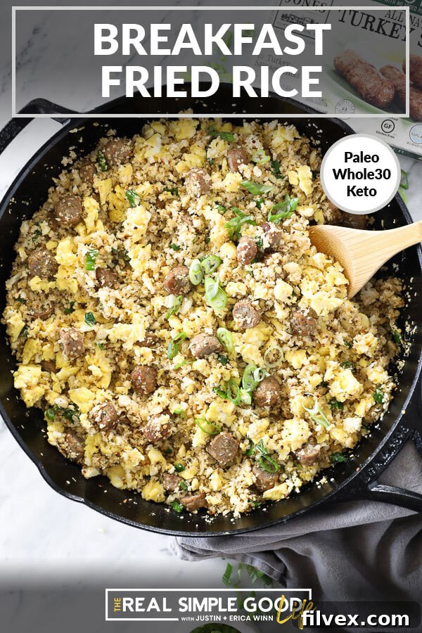 Breakfast fried rice in a skillet with a wooden spoon and chopped green onion sprinkled on top. Text overlay at top: 'Healthy & Hearty'.