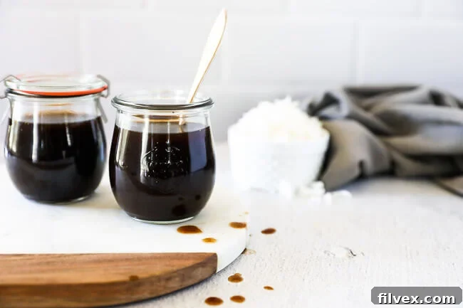 DIY coconut aminos substitute in two jars with rice in background horizontal image