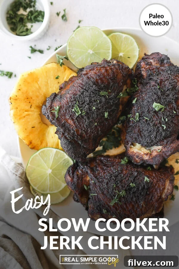 Beautifully presented slow cooker jerk chicken on a plate with fresh pineapple and lime, featuring text at the bottom of the image.