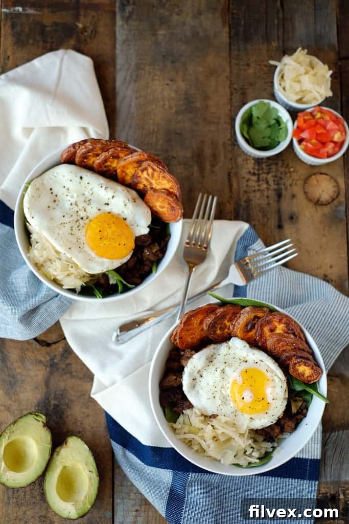A vibrant and appetizing taco breakfast bowl filled with fresh ingredients.