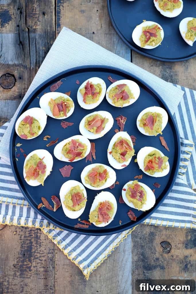 The delicious combination of creamy avocado and crispy, salty prosciutto makes these Mayo Free Deviled Eggs a perfect Paleo and Gluten-Free appetizer that's easy to prepare.