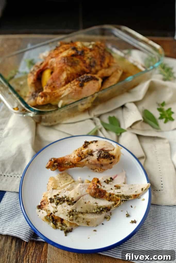 Close-up of Herb Roasted Chicken showing golden skin and juicy texture
