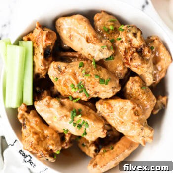 Overhead image of Buffalo Air Fryer Frozen Chicken Wings (No Thaw) tossed in creamy buffalo sauce