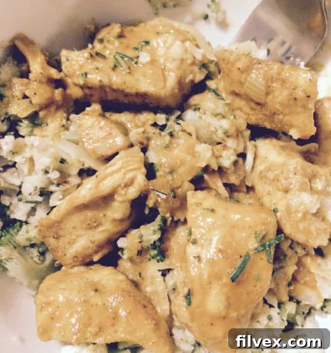 Delicious and healthy Paleo Chicken Curry served with cauliflower broccoli rice