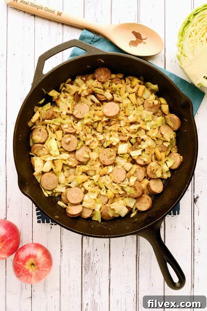 Delicious Cabbage and Sausage Side Dish with crispy bacon and tender apples