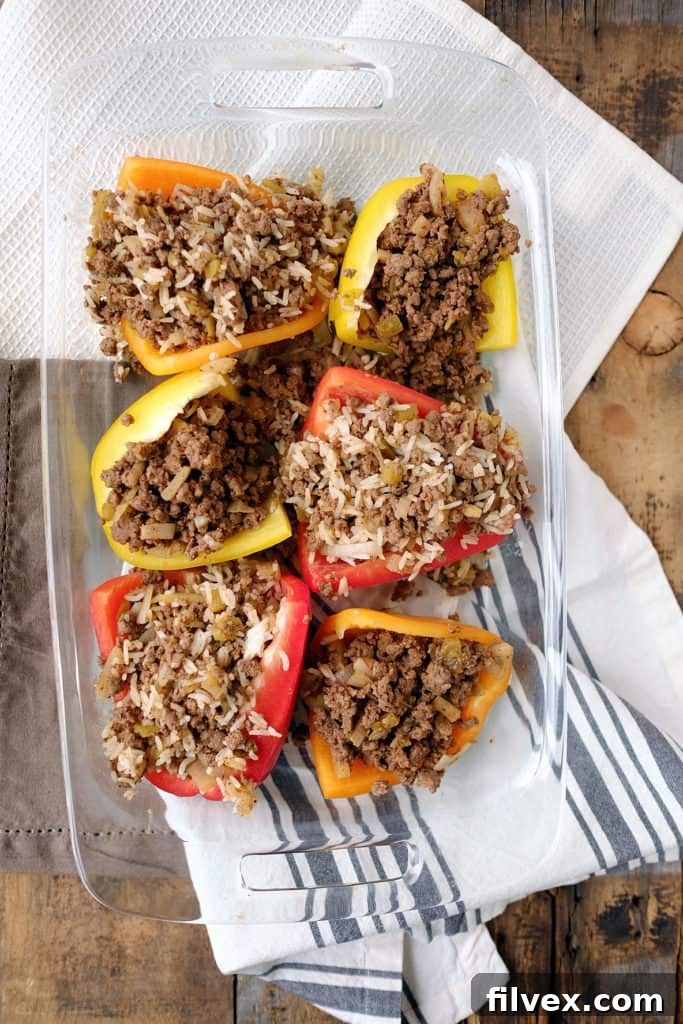 Freshly baked Taco Stuffed Bell Peppers before adding toppings, showcasing their vibrant colors and hearty filling ready to be served.