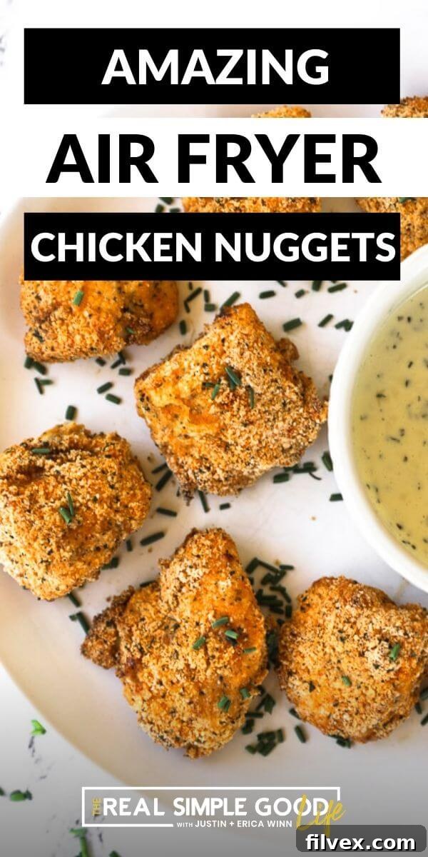 A vertical image of air fryer nuggets on a plate with text overlay at the top that reads 'Crispy Gluten-Free Air Fryer Chicken Nuggets'.
