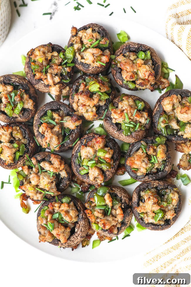 Another perspective of the stuffed mushrooms, highlighting their texture and appealing golden-brown top.