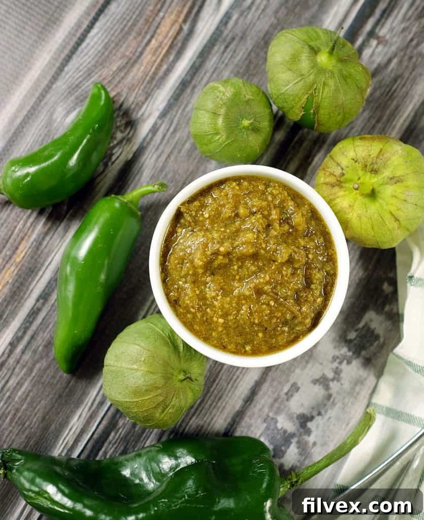 Tomatillos and chilies, garlic and cilantro blend to make the perfect sauce for tender pork in this easy Paleo + Whole30 crockpot pork chile verde recipe. Paleo + Whole30 | realsimplegood.com