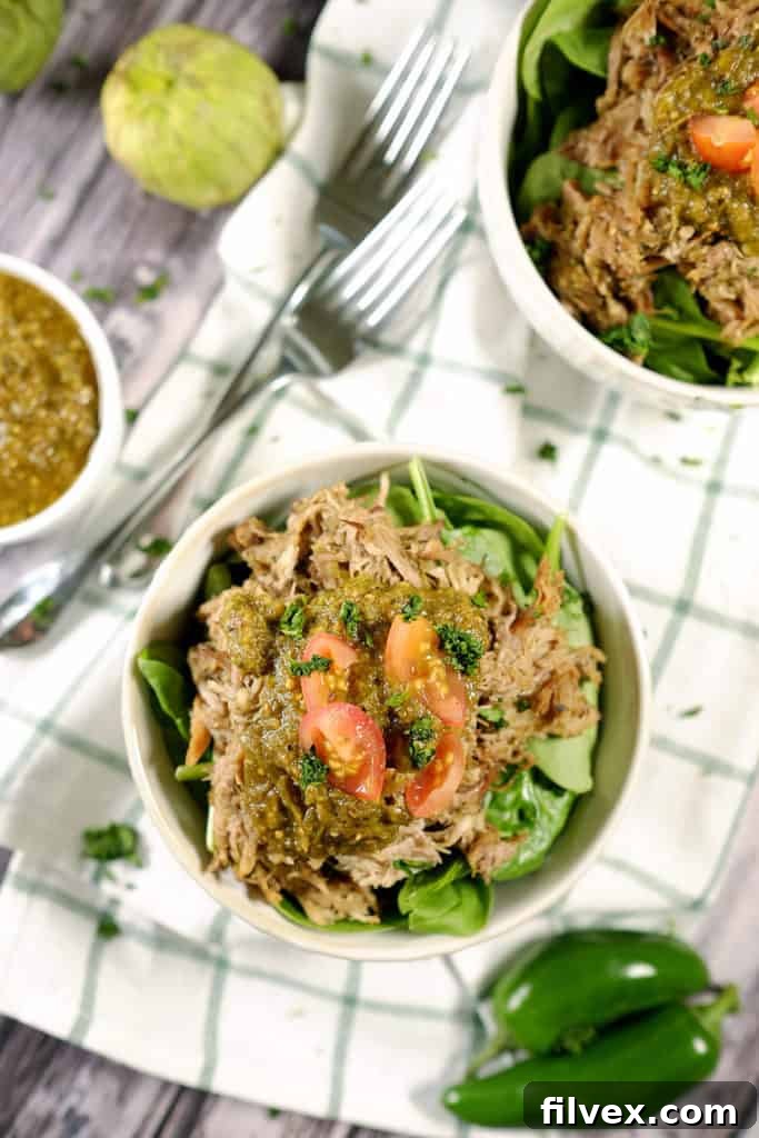 Tomatillos and chilies, garlic and cilantro blend to make the perfect sauce for tender pork in this easy Paleo + Whole30 crockpot pork chile verde recipe. Paleo + Whole30 | realsimplegood.com
