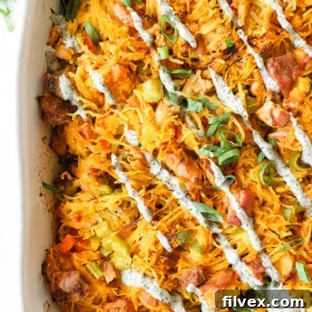 A vibrant and spicy Buffalo Chicken Casserole, served in a rustic casserole dish.
