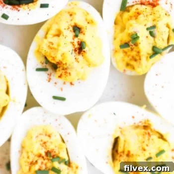 Close up overhead image of bunched together deviled eggs, highlighting their delicious appeal and perfect for a keto diet.