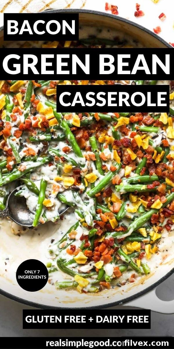 Vertical image with text overlay at the top. Image is a close up overhead shot of the green bean casserole in a skillet. Topped with crumbled bacon bits and crushed up plantain chips.