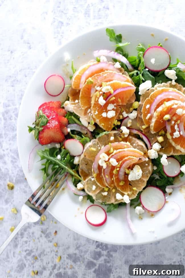 This summer citrus salad has layers of flavor from the spicy arugula, earthy radishes, sweet oranges and grapefruit to tangy goat cheese and pistachios. Paleo, Gluten-Free and Refined Sugar-Free. This vibrant dish is light, crisp, and perfect for warm weather.