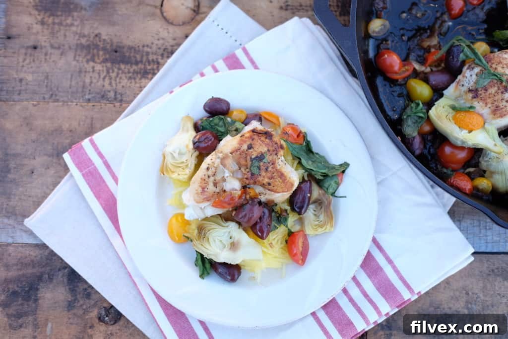 One Pan Mediterranean Skillet 2 - Close-up of cooked chicken and vegetables.