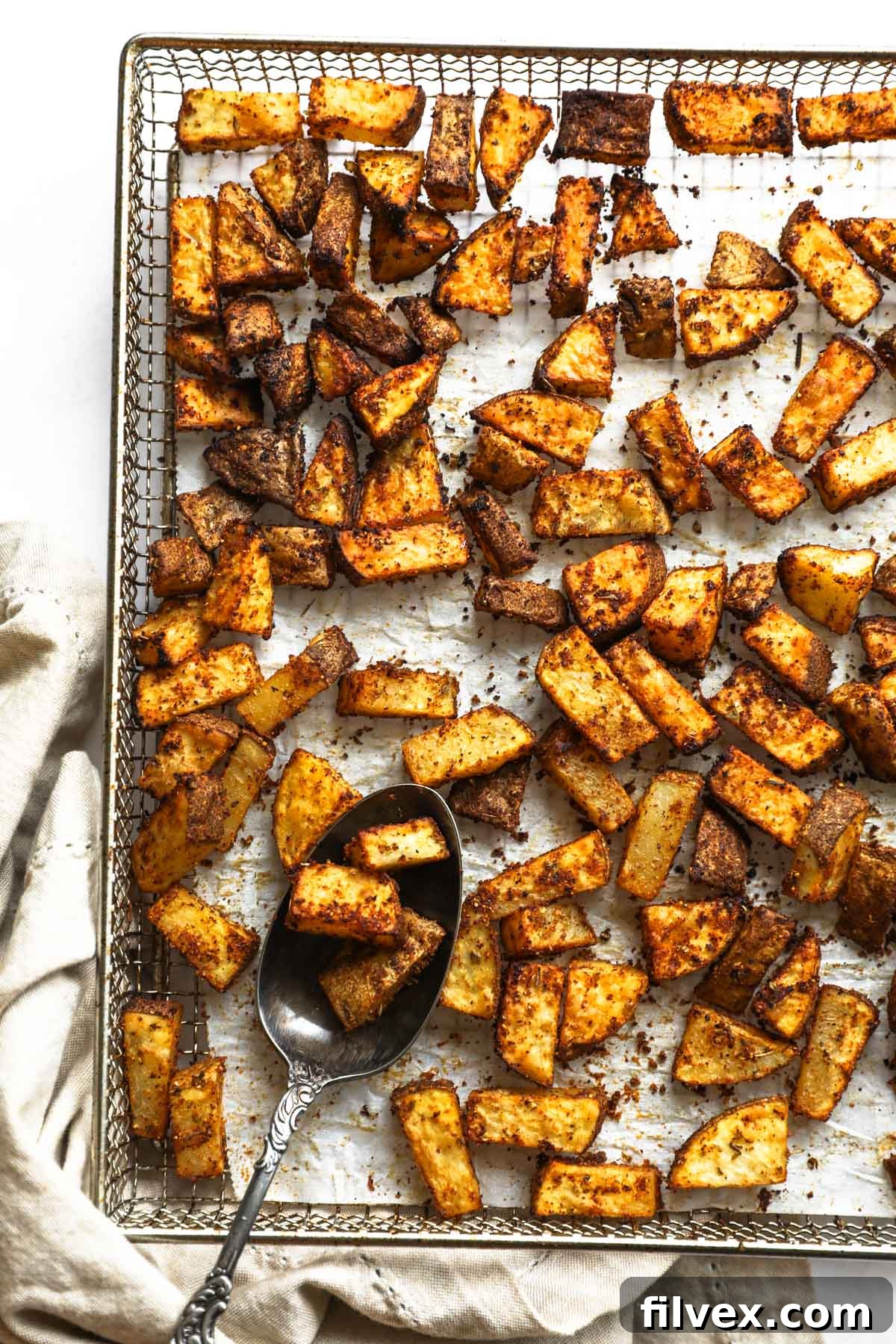 Air Fryer Breakfast Potatoes served with a fried egg